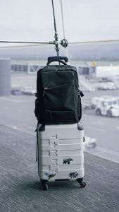 backpack on suitcase on airport